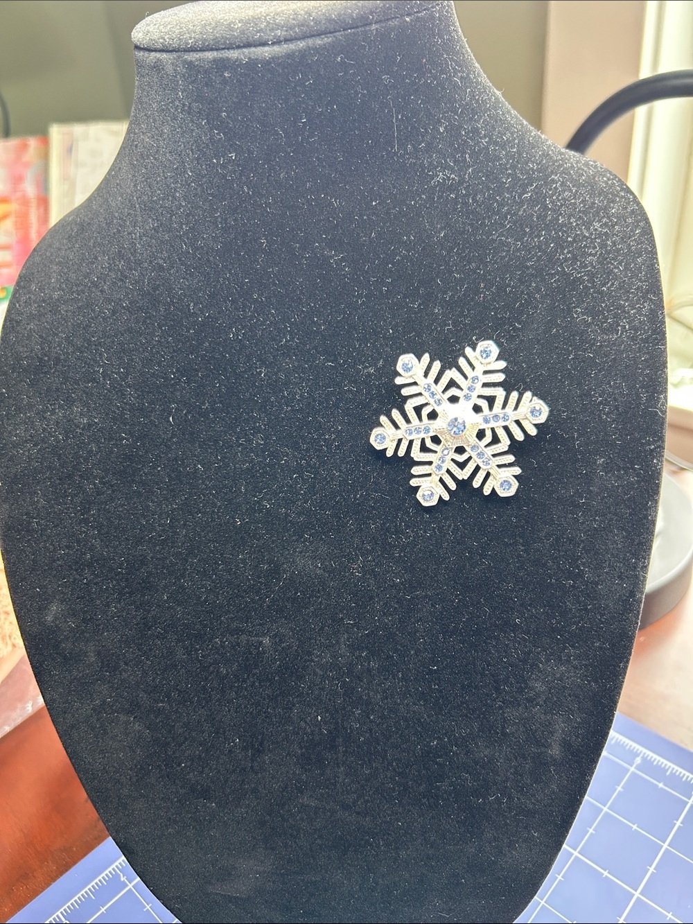 Icy blue RS on winter Solstice snowflake on pewter brooch for your holiday coat